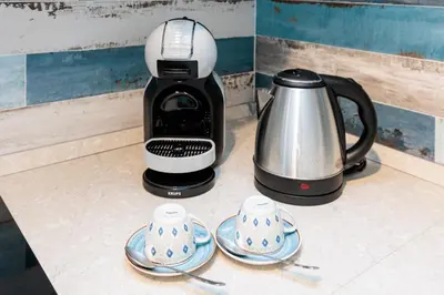 Set per la preparazione di tè e caffè presso Accogliente Monolocale Veneziano1 Aria Condizionata, vicino a campus e stazione