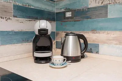 Set per la preparazione di tè e caffè presso Accogliente Monolocale Veneziano1 Aria Condizionata, vicino a campus e stazione