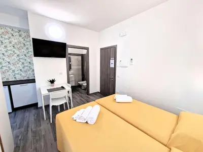 Letto o letti in una camera di Medici Alloggi Turistici