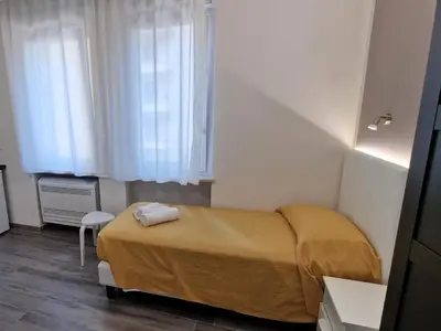 Letto o letti in una camera di Medici Alloggi Turistici