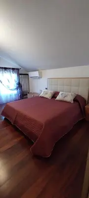Letto o letti in una camera di Ca' SVIZZERO
