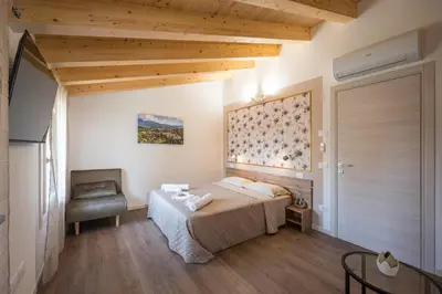 Letto o letti in una camera di Fienile Nonna Elide