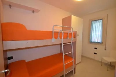 Letto o letti in una camera di Bright apartment surrounded by greenery