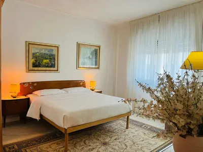 Letto o letti in una camera di Thalia Venezia appartamento accogliente