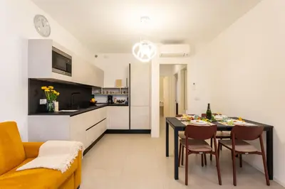 Cucina o angolo cottura di Sun Village Residence con Piscina - Piazza Aurora - Adria Holiday Jesolo - FAMILY APARTMENTS