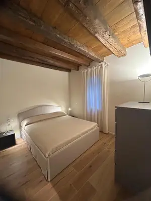Letto o letti in una camera di Casa Milena
