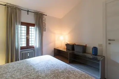 Letto o letti in una camera di EnJoy Home - Bilocale centralissimo in via Roma