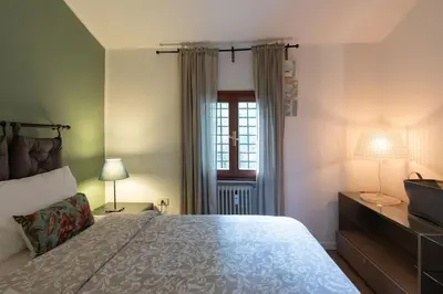 Letto o letti in una camera di EnJoy Home - Bilocale centralissimo in via Roma