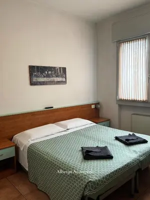 Letto o letti in una camera di Albergo Acampora