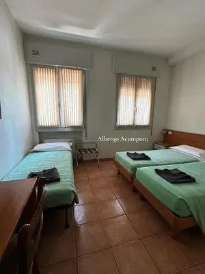 Letto o letti in una camera di Albergo Acampora