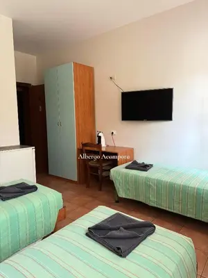 Letto o letti in una camera di Albergo Acampora