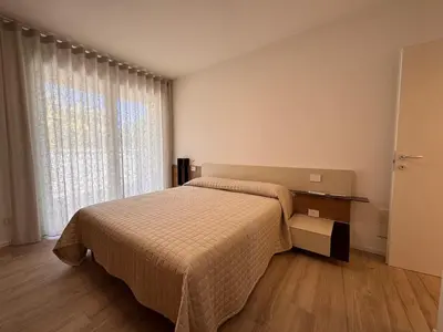 Letto o letti in una camera di East Side Apartments