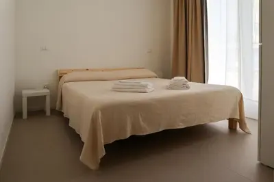 Letto o letti in una camera di Riviera Venice Apartments