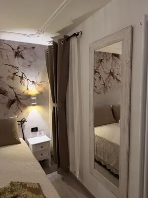 Letto o letti in una camera di Palazzo Carignano