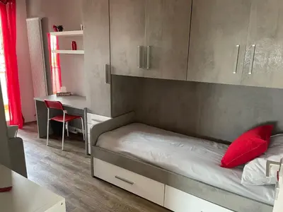 Letto o letti in una camera di Casa Dada