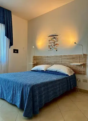 Letto o letti in una camera di Hotel Fortuna