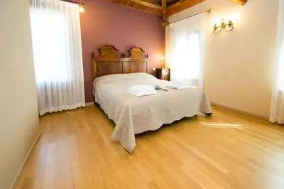 Letto o letti in una camera di Le camere del nonno Momi