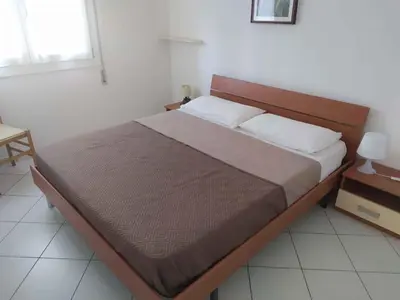 Letto o letti in una camera di Apartment in Rosolina Mare 25013