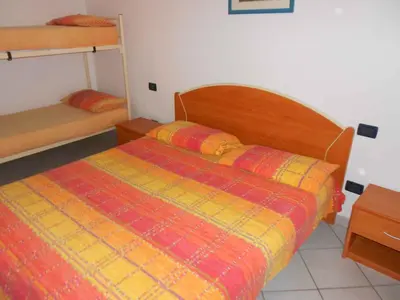 Letto o letti in una camera di Apartments in Rosolina Mare 24930
