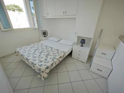 Letto o letti in una camera di Holiday Homes in Rosolina Mare 25014
