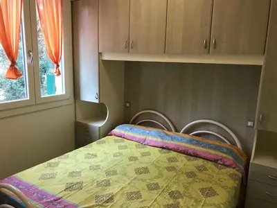 Letto o letti in una camera di Holiday Homes in Rosolina Mare 24977