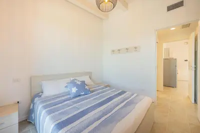 Letto o letti in una camera di Wave Island Torre B23