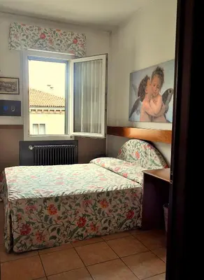 Letto o letti in una camera di Hotel Roma