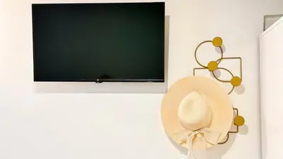 TV o dispositivi per l'intrattenimento presso Gesuiti cozy and central apartment by Ca-Sa Check