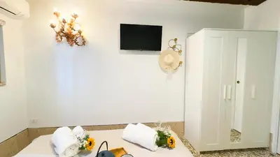 TV o dispositivi per l'intrattenimento presso Gesuiti cozy and central apartment by Ca-Sa Check