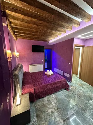 Letto o letti in una camera di Venice Rainbow Apartments BIENNALE