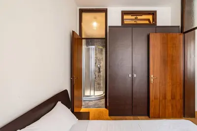 Letto o letti in una camera di GuestHost - Padova Suite Isabella 500 meters from the Duomo!