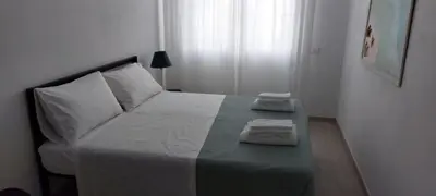 Letto o letti in una camera di Appartamenti Le Conchiglie Sottomarina