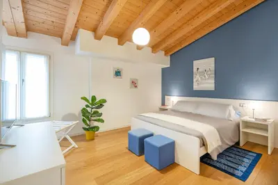 Letto o letti in una camera di Ca' Degli Antichi Giardini Apartments