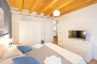 Letto o letti in una camera di Ca' Degli Antichi Giardini Apartments