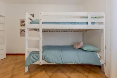 Letto o letti in una camera di Gate3-MarcoPoloAirport-3 camere da letto-Wifi-Netflix-15' from Venice