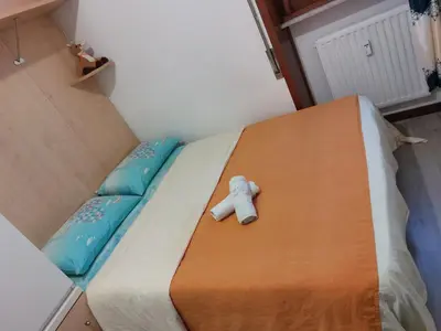 Letto o letti in una camera di Punto FM