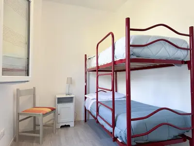 Letto o letti in una camera di Casa indipendente, 500 m dal mare, Wifi, free park