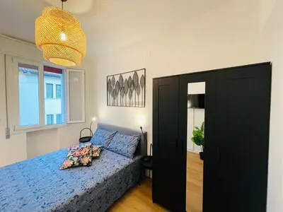 Letto o letti in una camera di Appart ristrutturato con 3 camere da letto, 2 bagni e Terrazza
