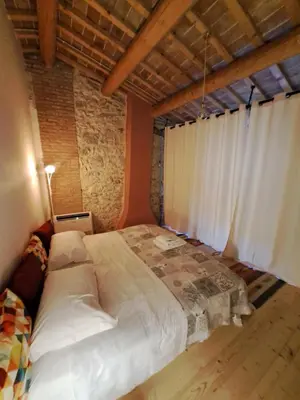 Letto o letti in una camera di Appartamento con Spa Privata e vista falesia - La Perla a Lumignano