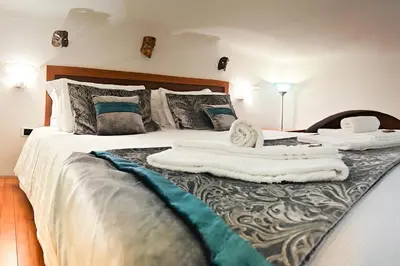 Letto o letti in una camera di CASA BRUVER Biennale Venezia - centro storico VENEZIA