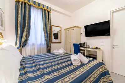 Letto o letti in una camera di Ca'Paradiso