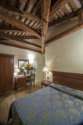 Letto o letti in una camera di B&B Le Marie