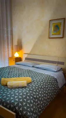Letto o letti in una camera di Casa Luna appartamento alle Terme con 3 Camere da Letto vicino alla Stazione