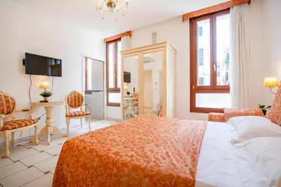 Letto o letti in una camera di Casa Marsilli