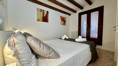 Letto o letti in una camera di City Apartments Salute-Accademia