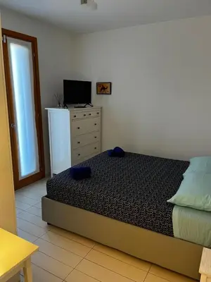 Letto o letti in una camera di Villa AdeMar Nel cuore di Jesolo