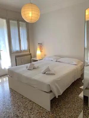 Letto o letti in una camera di Comodo appartamento al centro del Lido di Venezia