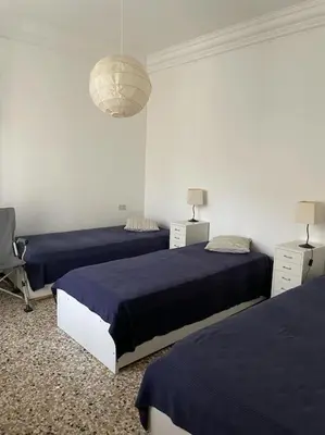 Letto o letti in una camera di Comodo appartamento al centro del Lido di Venezia