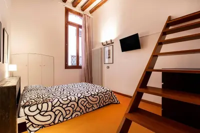 Letto o letti in una camera di Design Loft in Venice - San Polo