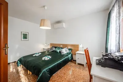 Letto o letti in una camera di QUEEN HOME Carlotta